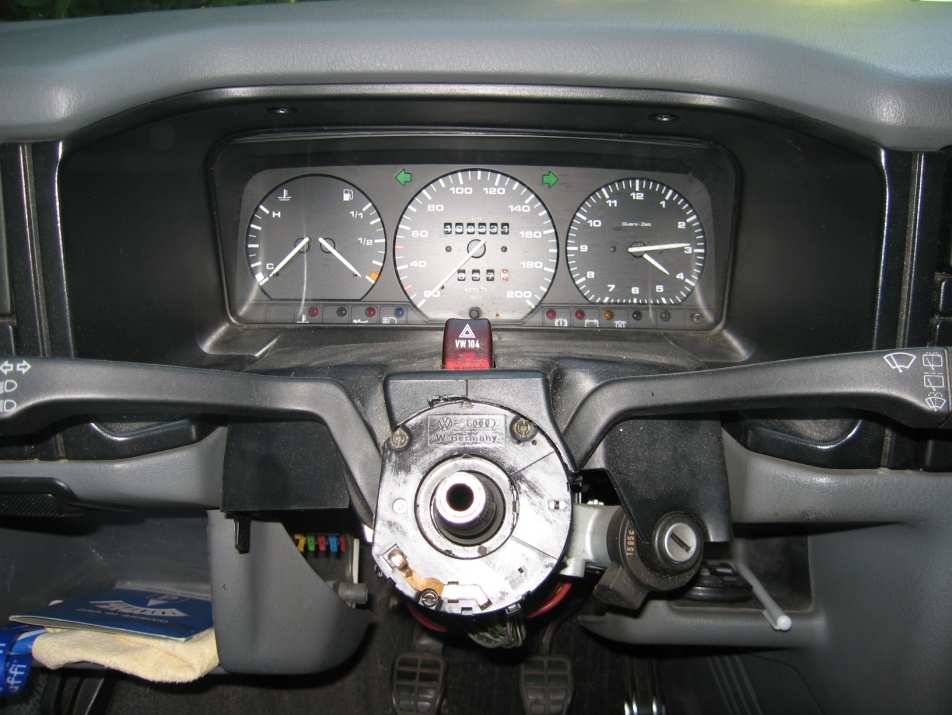 T4 dashboard with the steering wheel and shroud removed: the steering column, the stalk switch unit and the instrument cluster are visible
