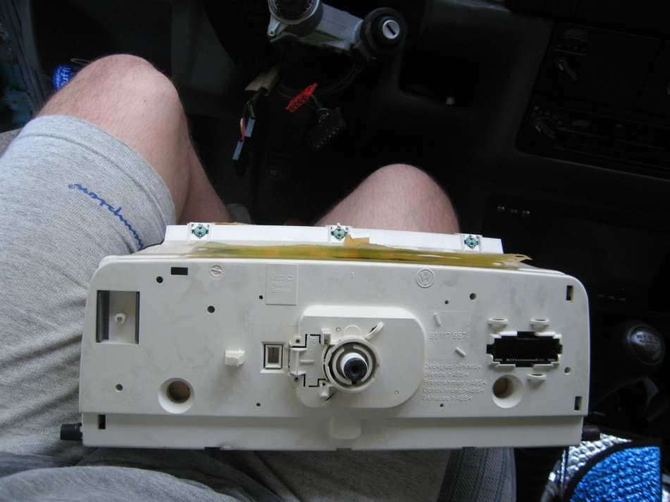 The back of the removed instrument cluster, with the speedometer cable socket
