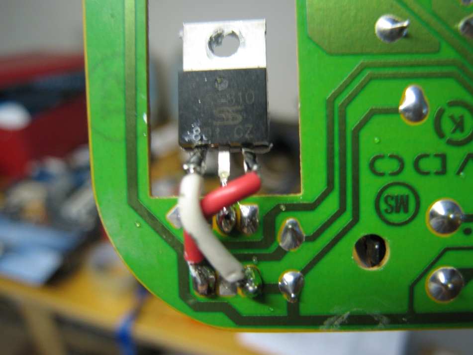 Close-up of the TS7810 regulator soldered to the board, with the crossed wires