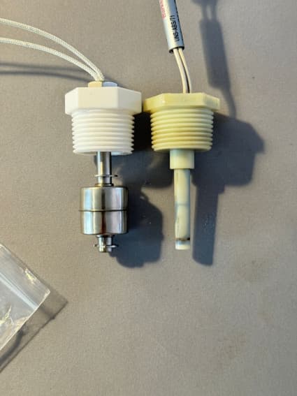 New single-float grey water sensor next to the original sensor